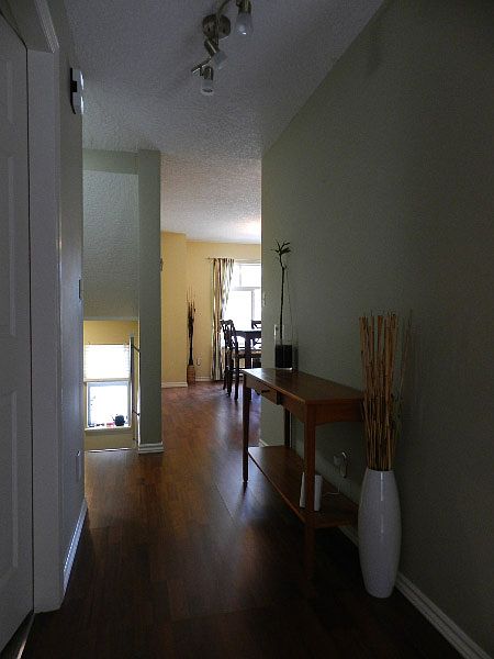 Main Floor Hallway from Living Room looking to the Front Entranceway (on the left) and Dining Room (on the right).