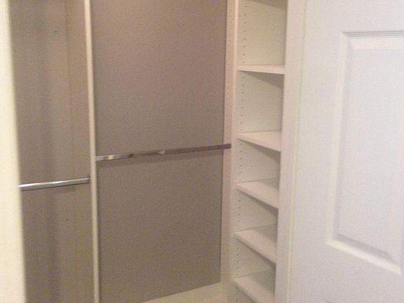 custom cabinets in both walk in closets