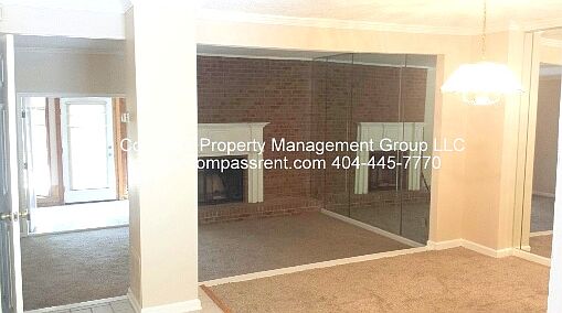 Living room with mirrored accent wall