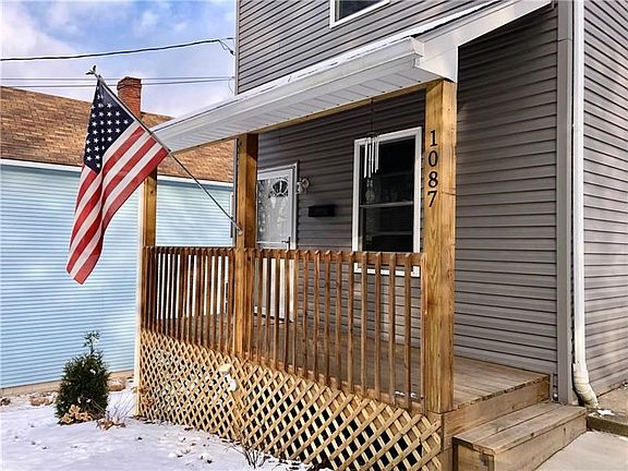 Inviting front porch with new landscaping completed in the fall of 2018.