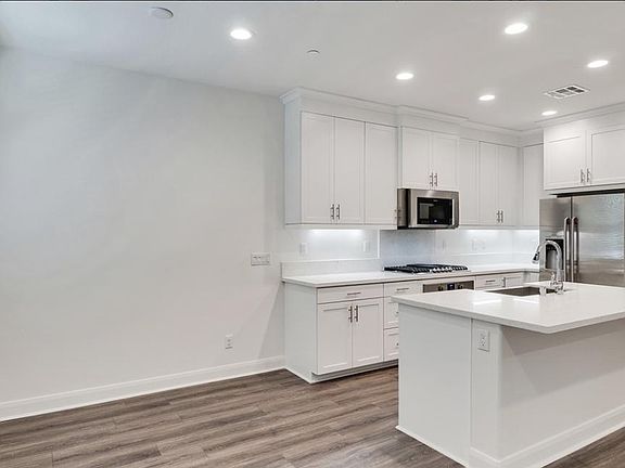 KITCHEN INCLUDES: MICROWAVE, NEW DOUBLE DOOR FRIDGE, OVEN, DISHWASHER, STAINLESS STEAL FARM SINK