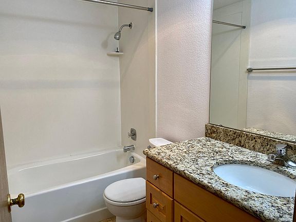 Full bathroom with granite countertop