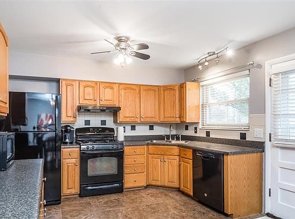 Updated, bright, eat in kitchen with newer appliances and plenty of storage.