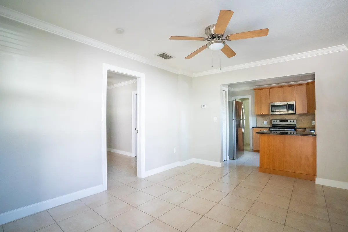Living Room & Kitchen. Left door leads to Bedroom. - 406 W Princeton St