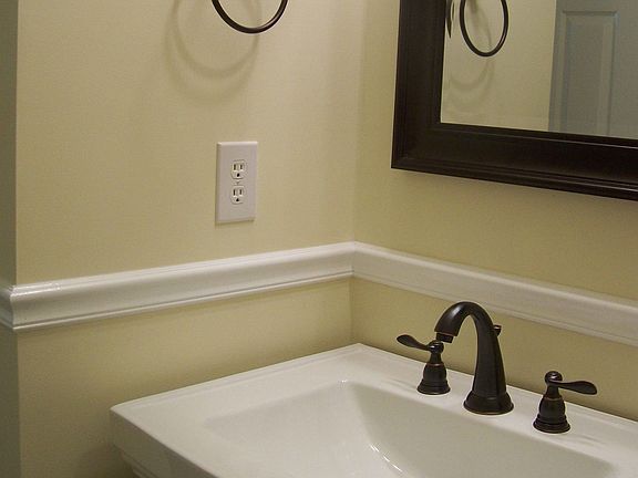 Half bath downstairs with pedestal sink