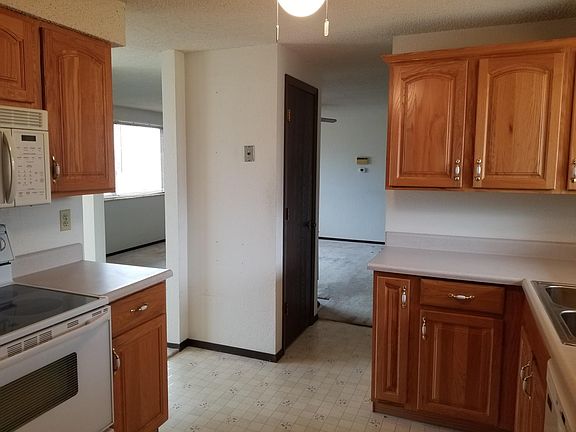 Kitchen is central to the house leading to the living room and the dining room/backyard.