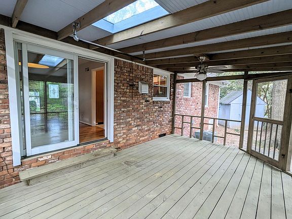 Dine al fresco and bug-free on this large screened-in porch.