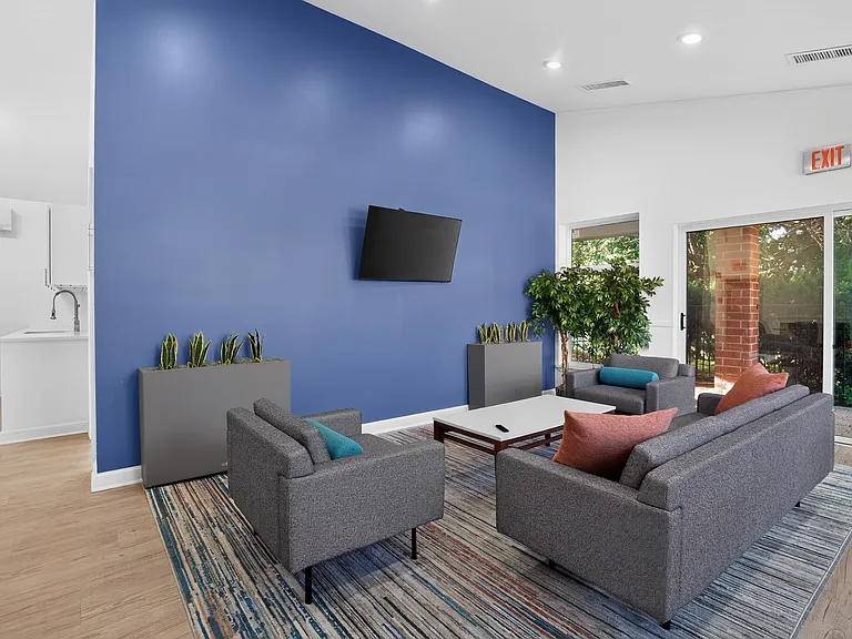 Join us in this stylish lounge at Eagle Rock Apartments at Swampscott, where modern design meets comfort. Enjoy spacious seating, vibrant decor, and a welcoming atmosphere perfect for relaxation. Schedule your tour today to see it in person!