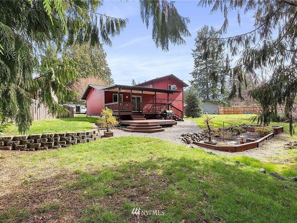 Partially fenced, private backyard w/ greenbelt has raised garden beds, BBQ patio, & plenty of underdeck storage!