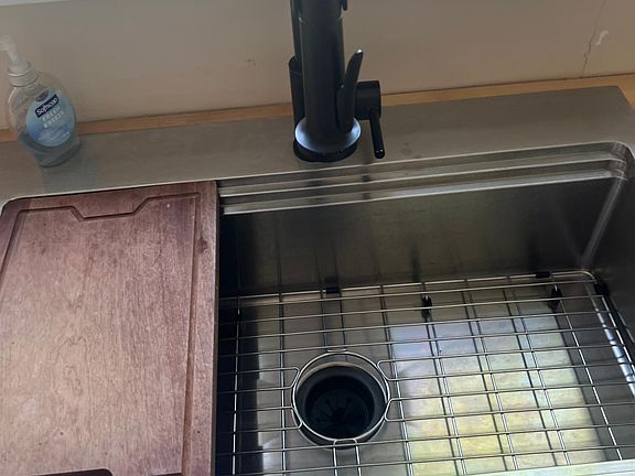 New sink, butcher block countertops, garbage disposal.