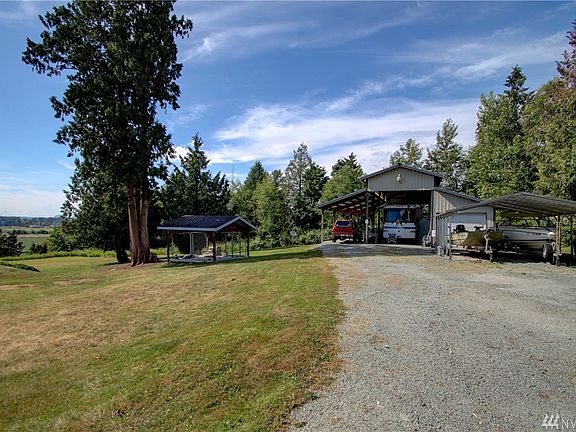 30x50 Shop with 2 full RV hook ups and enclosed Man Cave/office with bathroom. Covered Dog Kennel.
