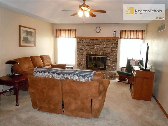 Great room features a brick fireplace. New carpeting and new interior paint.