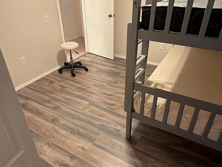 Bedroom #2 comes equipped with a bunk bed (optional), built in shelving for closet, a window and luxury vinyl flooring.