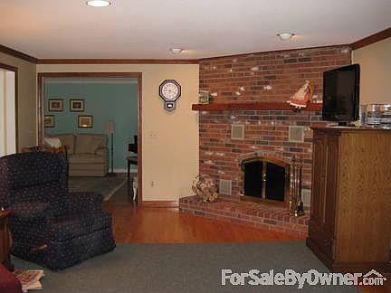FAMILY ROOM WITH FIREPLACE
						:
						LARGE 14' X 24' ROOM FEATURES CORNER FIREPLACE WITH BRASS/GLASS DOORS