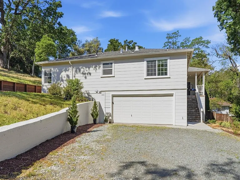 Private driveway with attached two-car garage