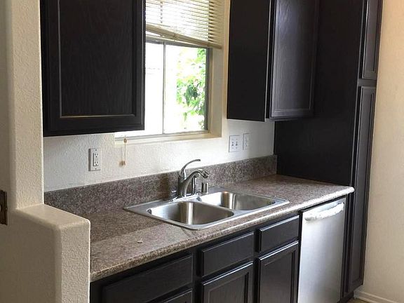 Granite countertop with stainless steel appliances.