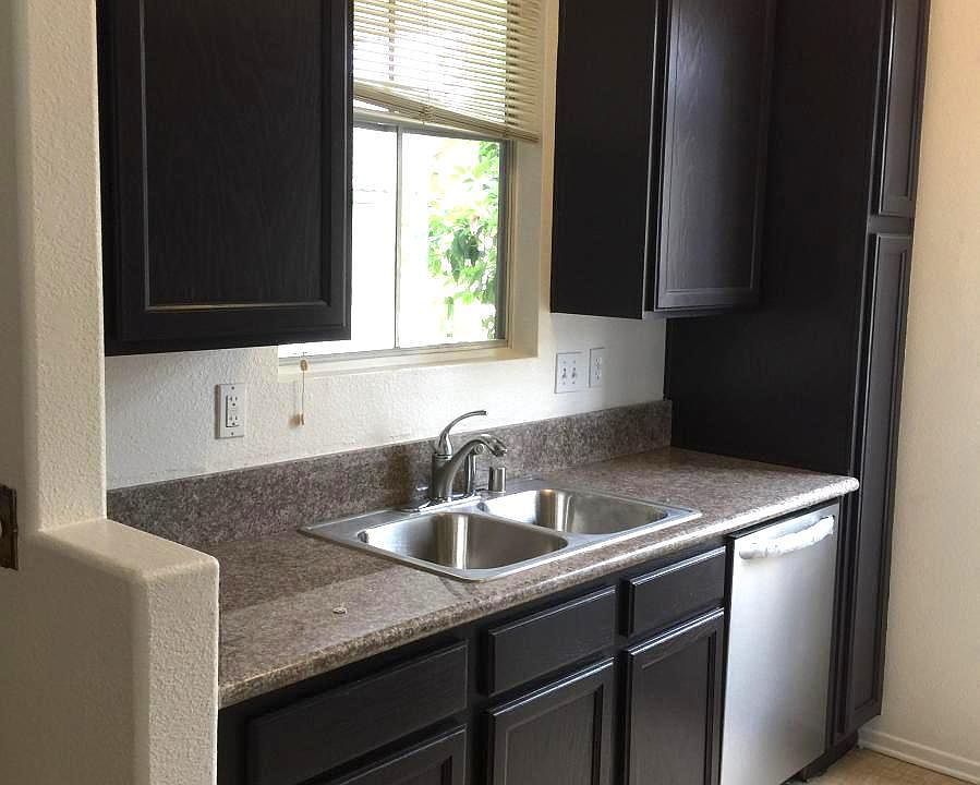 Granite countertop with stainless steel appliances.