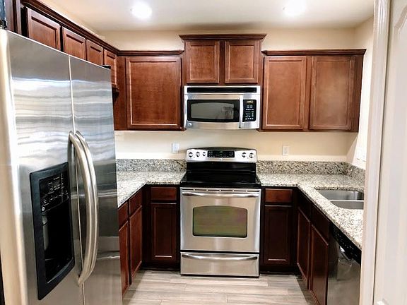 kitchen with granite countertops & stainless steel appliances