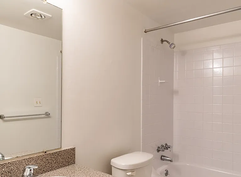 Bright white bathrooms with heat lamps for a sauna-like experience!