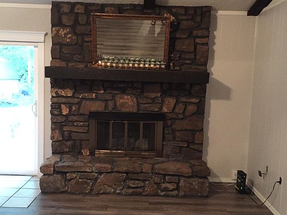 Gas fire place in living room. Sliding glass door to back yard