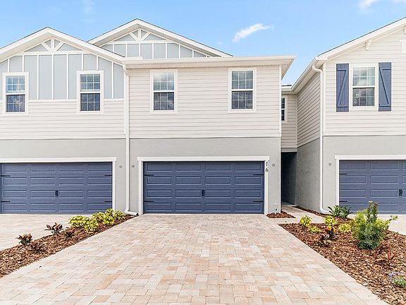 This spacious two-story townhome includes a 2-car garage and paver driveway.