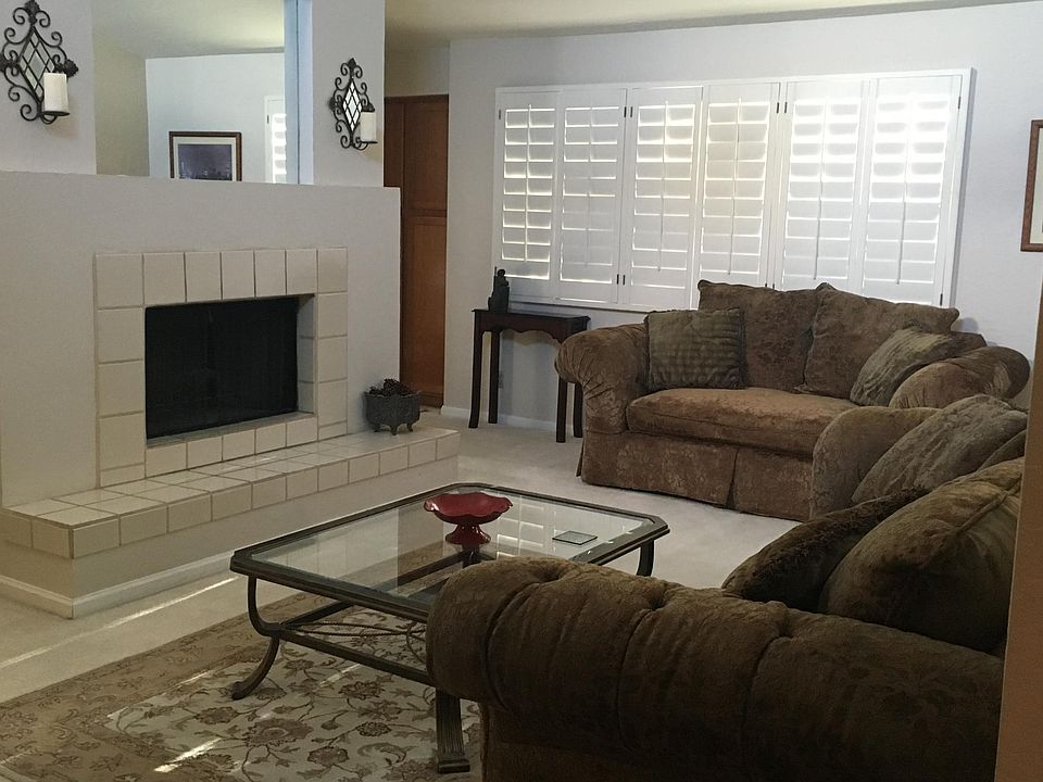 Large living area, bright with high ceilings, and balcony around the corner.