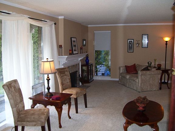 Cozy Living Room with brand new mantel over the fireplace.