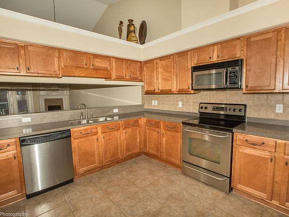 the kitchen has a pass through to the dining room area and ample cabinet space