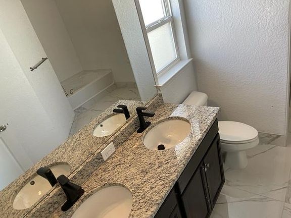 Spacious bathrooms with modern fixtures, combined style and functionality