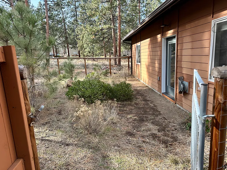 Fenced in outdoor area for dogs (plans for paver patio install next summer)