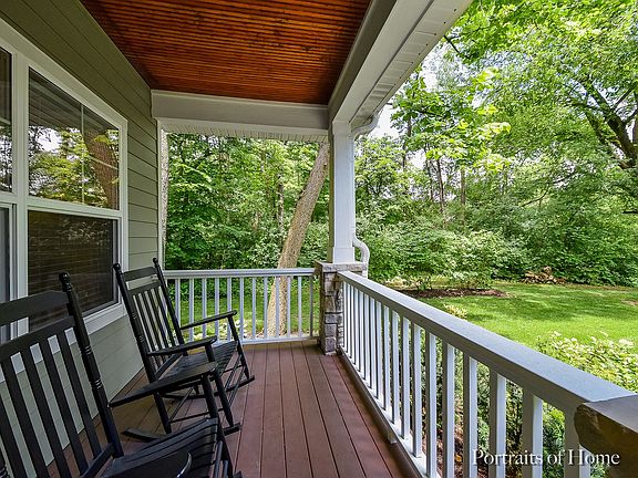 Peaceful seating area on the front porch that looks out to Forest Preserve.