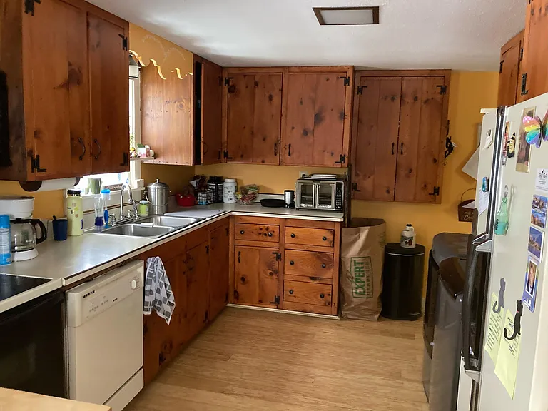 other view of the kitchen, the washer and dryer are located in the kitchen