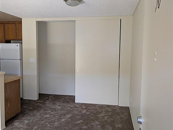 The dining room with bonus closet space. Enjoy meals in a cozy dining area that features a versatile closet- perfect for extra storage, a pantry, or even a compact office set-up. This unique addition adds functionality to your everyday living.