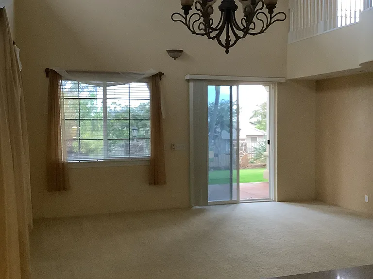vaulted dining/living room view from kitchen