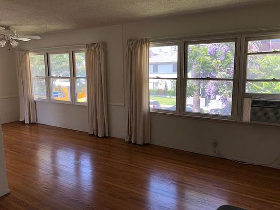 Living room, dining room with windows facing street
