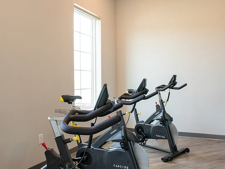 The Nese fitness center includes a private cycling room with spin bikes.
