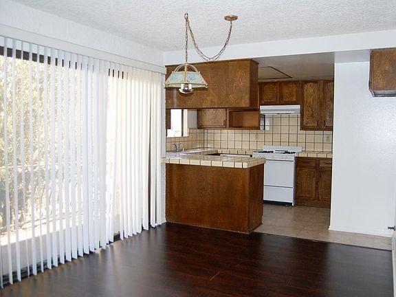 Dining Room to Kitchen - patio sliders open to large balcony