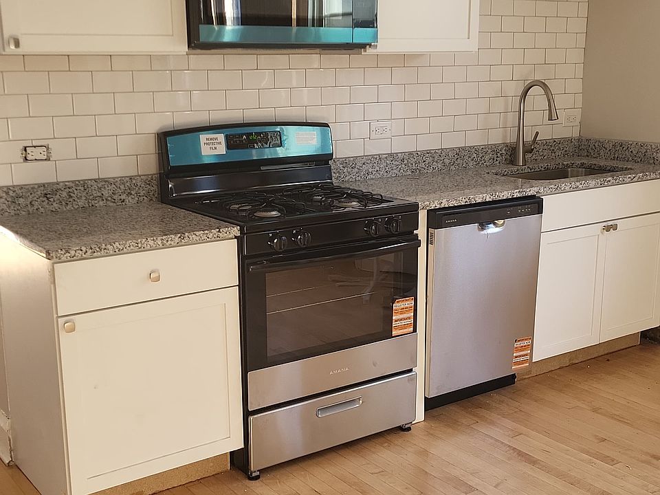 Kitchen. New: cabinets, appliances, flooring, countertops, faucet and backsplash.