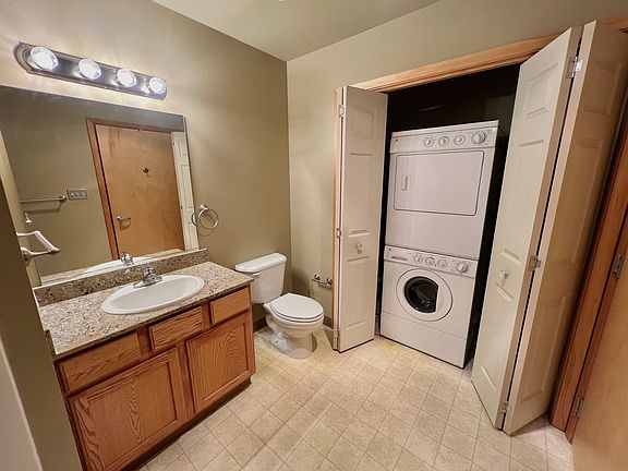 Bathroom with washer and dryer in unit