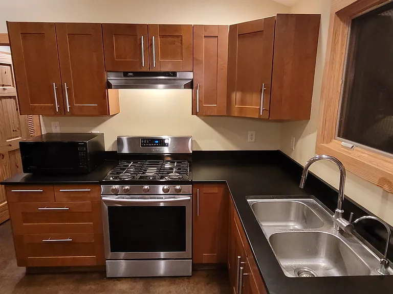 The kitchen's got it all! Microwave, Range / Oven, Sink and spigot with pull-down sprayer, dual cartridge water filter spigot, and dishwasher (not pictured). Through the kitchen window, you often see deer grazing.