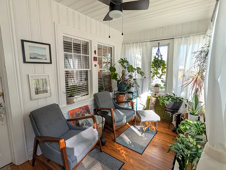 Your window to the neighborhood begins with this gem of a four-season porch. Watch the world go by while enjoying your favorite beverage. (Note: plants and furniture not part of the rental. For staging purposes only.)