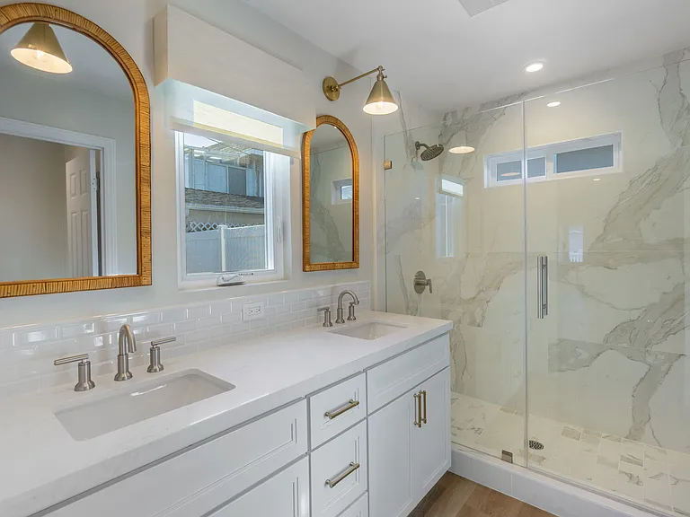 Stunning primary bathroom with dual sinks and designer finishes