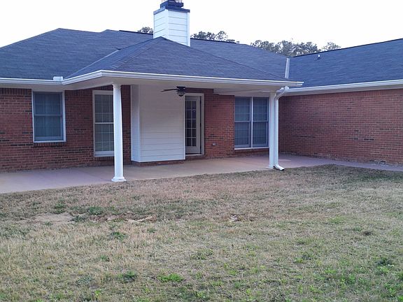 Fenced back yard with patio