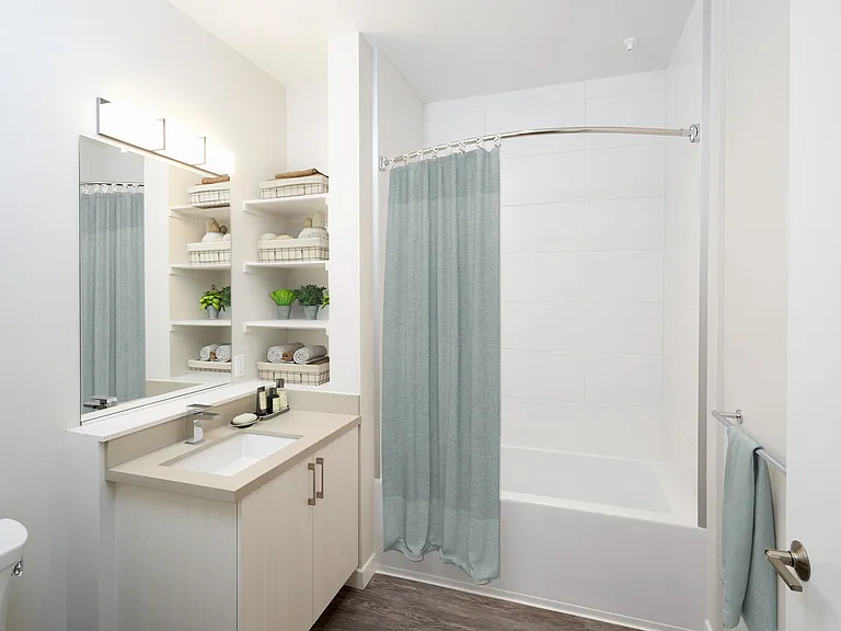Built in storage and curved shower curtains.