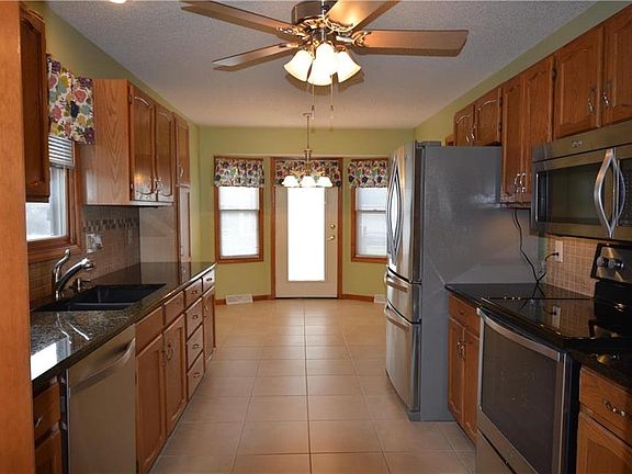 Spacious kitchen with ceramic tile, granite counter tops and stainless appliances that stay!