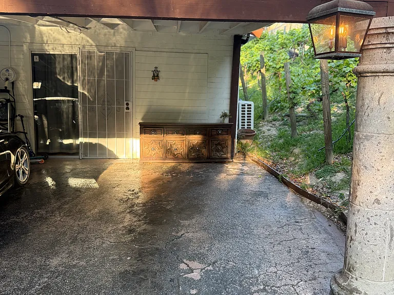 Parking spot at Carport and Entrance to the Guest House front side.
