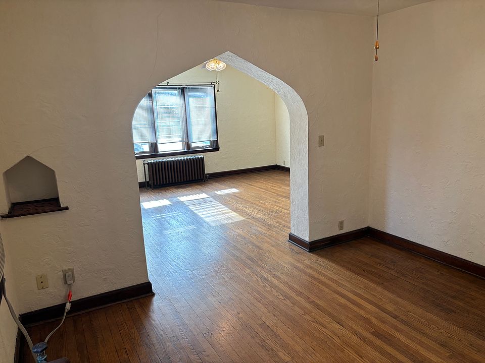 Dining room with arch to living room.