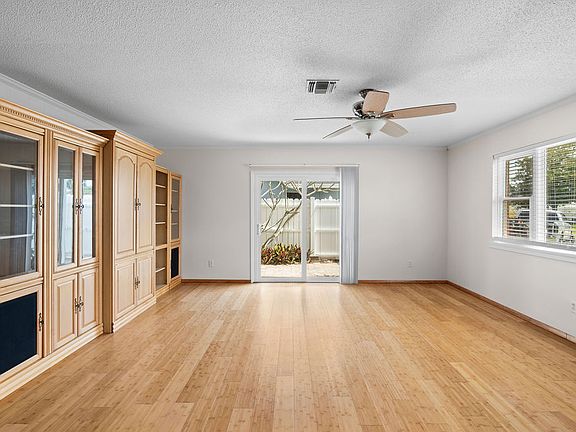 Family Room with Bookcases and Cabinets