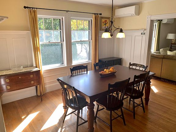 Dining room located off living room separated by gorgeous French doors.