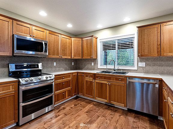Large, oversized kitchen is a chef's delight. Plenty of room for two chefs in this kitchen. Ample cabinet space and upgraded appliances.